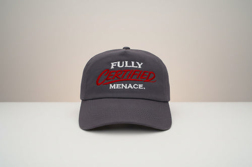The Cap Shack charcoal grey 5-panel cotton cap with embroidered "FULLY CERTIFIED MENACE." in red and white. Pre-curved peak.